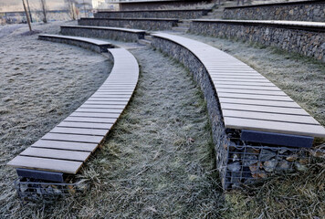 above, aerial view, amphitheater, amphitheatre, arch, architecture, auditorium, bench, benches, bent, brown, cinema, classroom, cobblestone, curved, drone point of view, encircle, film, frosted, gabio