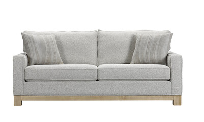 A sofa with pillows in a minimalist design with wooden legs + clipping path. The sofa is isolated on a White background.