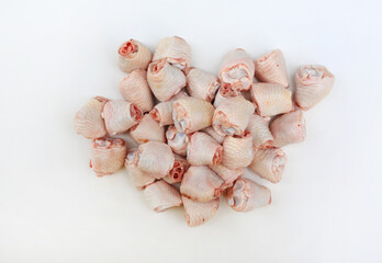 Raw chicken joint bones on white background. Chicken Ingredients for cooking. Top view.