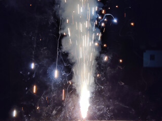 Picture of firework fire pot shot during night. Flames, Diwali celebration
