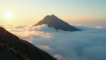 Fototapeta premium Breathtaking Sunrise View of Mount Bromo Over Misty Mountains and Golden Gradients