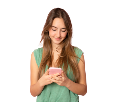 Portrait of a smiling young casual caucasian woman looking at mobile phone isolated over transparent background. PNG transparent.