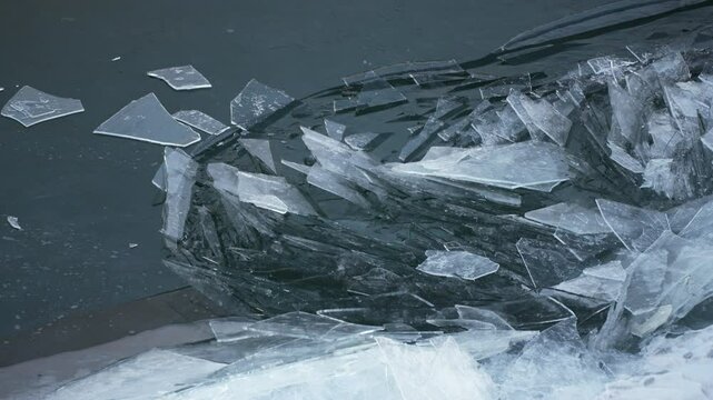 New thin ice moving on water surface and breacking in arctic envinronment