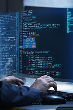 Hands working on keyboard with fictional code display, representing virtual interplay of human ingenuity and problem-solving in programming. Concept of IT solutions, applications, programming. Ad
