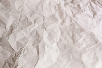 Crumpled white paper background.