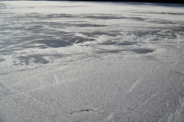 Frozen lake with snow and frost