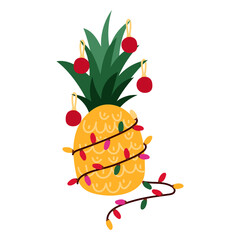 A whole pineapple is decorated with a garland and Christmas tree toys for Christmas and New Year. A tropical vacation during the winter holidays. The fruit is decorated like a Christmas tree.