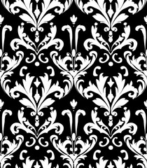 A decorative black and white damask pattern featuring intricate floral designs.