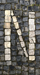 The letter N written in cobblestones