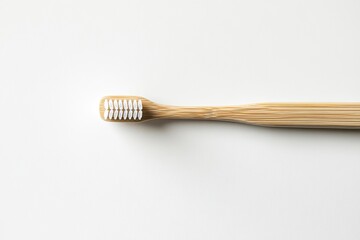 Natural bamboo toothbrush on minimalist background emphasizes ec