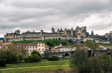 Fototapeta premium Panoramic view of the medieval castle of Carcassonne in France on a cloudy day.