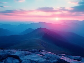 Pink and blue sunset over majestic mountain range.
