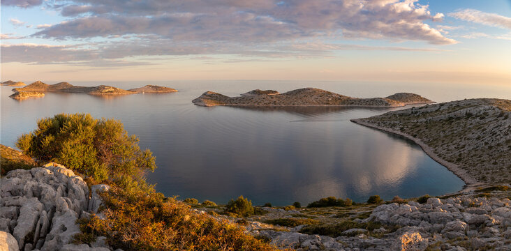  Kornati island archipelago at sunrise. Kornati National Park panorama, Croatia