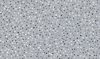 Polka dot pattern in black, white, and gray on a textured background for creative design projects
