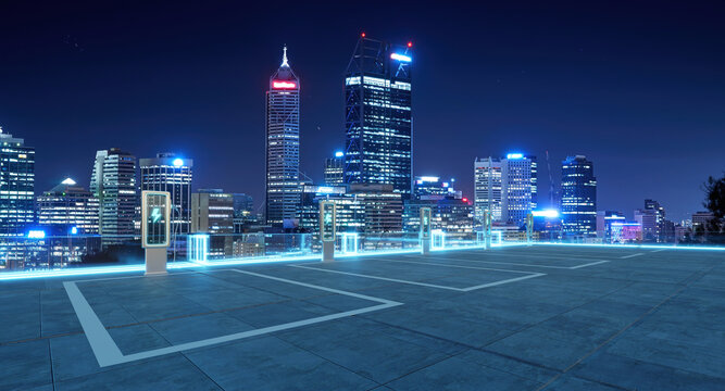 Electric vehicle charging stations illuminating perth city skyline at night