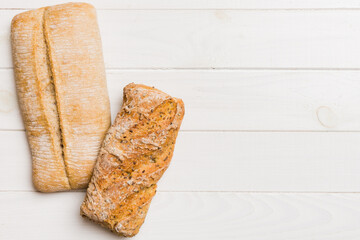 Homemade natural breads. Different kinds of fresh bread as background, top view with copy space