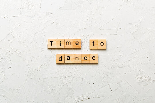 time to dance word written on wood block. time to dance text on cement table for your desing, concept