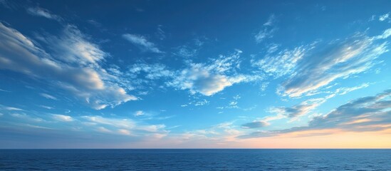 Fototapeta premium Ocean sunset, blue sky, cloudscape, calm sea