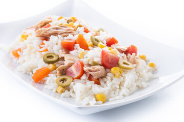 Rice salad with tomato, corn,olives and tuna isolated on white background