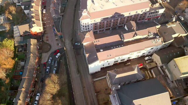 Forward travelling wide aerial shot of the Derry Walls in Derry-Londonderry, Northern Ireland. Filmed in 4K, 60fps and in Rec709 color.