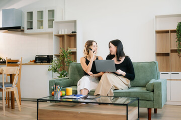 Explore vibrant teamwork, creativity, and learning with young adults using laptops and headphones in cozy