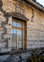 The window of a traditional stone house in the mountains of Epirus in Greece 