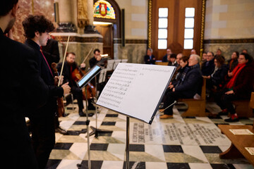 Musicians perform a classical concert in a historic church setting