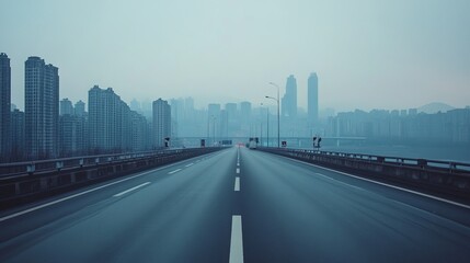 Fototapeta premium A desolate highway stretches towards the sprawling metropolis of Chongqing, China, its towering cityscape hazy in the distance. 