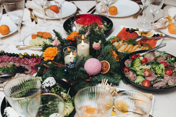 Beautiful table decoration for luxury  event in pink and gold, cutlery and tableware, banquet hall arrangement decor, celebration in restaurant with flowers, candles on a wedding reception party