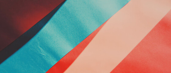 Naklejka premium Brightly colored construction paper laid out in an abstract arrangement for creative projects