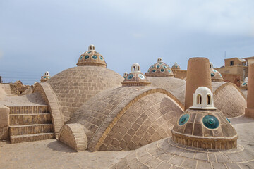 Building of the historic Sultan Amir Ahmad Bathhouse in Kashan, Iran. Traditional Persian roofs...