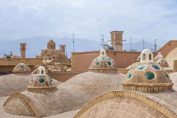Historical Persian roofs with domes and turrets for ventilation and air circulation inside the building. Building of the historical Sultan Amir Ahmad Bathhouse in Kashan, Iran