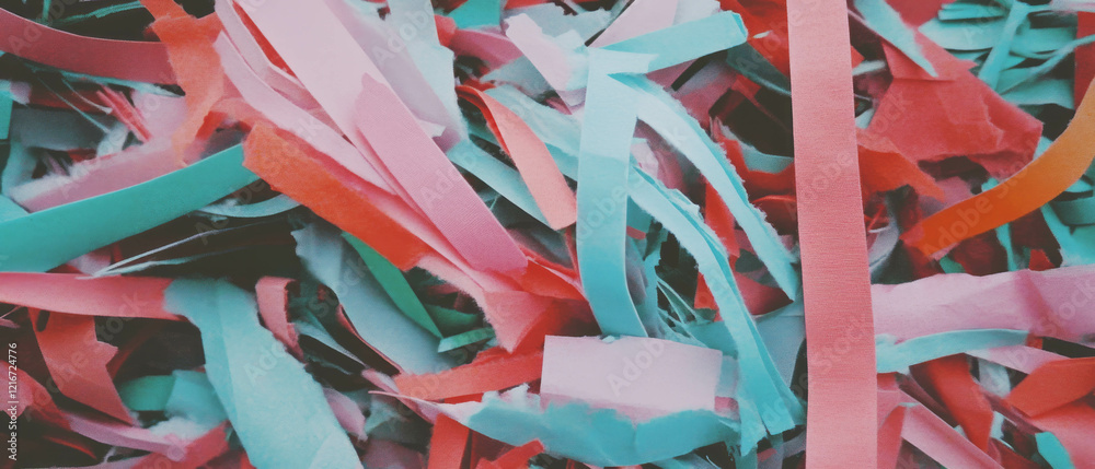 Poster shredded paper strips create a vibrant textured landscape in various colors