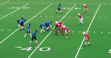 Two Diverse Athletic Teams Take Their Positions at The Start of the Tournament Game. The Ball is Ready to Start the Game. Players Prepare to Run Forward While the Opposing Team Attempts to Stop Them