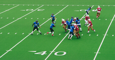 Red and Blue American Football Teams Battle for the Championship Trophy. Powerful Footballers  Scoring Points. Gridiron Tournament