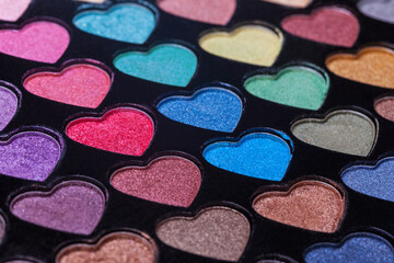 Heart Shaped Eyeshadow Set. Eyeshadow palette with colorful heart shaped refills close-up.