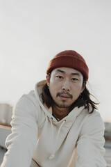 Portrait Photography Of A Young Man in Red Beanie And White Hoodie, Urban Fashion Photography