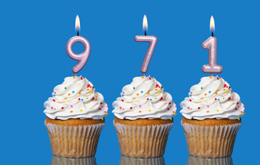 Birthday Cupcakes With Candles Lit Forming The Number 971