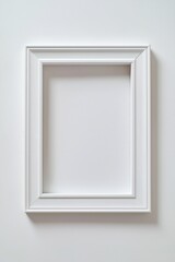 Minimalist white frame showcased on a clean, bright wall for artistic display purposes