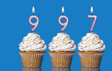 Birthday Cupcakes With Candles Lit Forming The Number 997