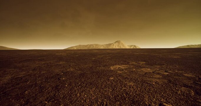 This mesmerizing view captures the rocky surface of Venus under a thick, hazy atmosphere, featuring distant mountains and an otherworldly landscape bathed in a yellowish hue.