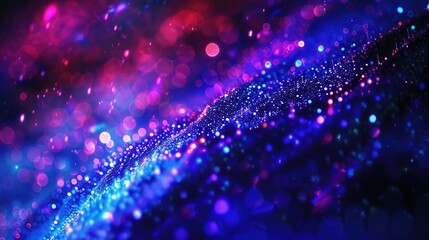 Obraz premium A vibrant abstract background with colorful bokeh effects and shimmering light patterns.