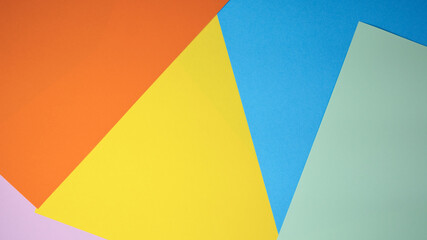 Colorful arrangement of paper sheets in vibrant geometric shapes