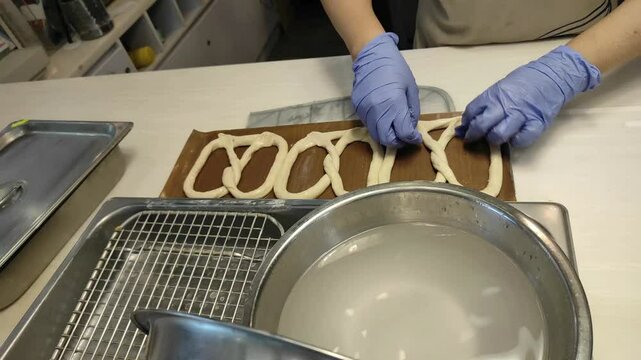 Dipping pretzel into warm water