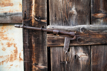 Ancient Door Latch on Rustic Swiss Barn, Vintage Farm Hardware