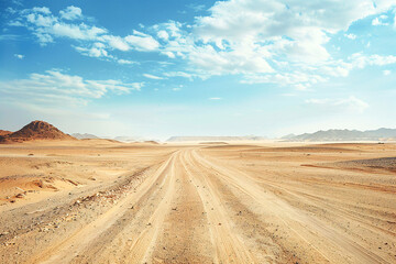 Fototapeta premium A sandy road cuts through an expansive desert surrounded by towering red cliffs and open skies.