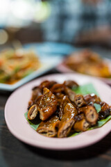 Grilled intestines, Roasted pork chitterlings. Famous street fast foods menu at thailand hot spicy sauces