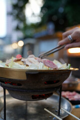 Take the pork and other meat and place it on a very hot grill pan. The fresh vegetables are boiled in the pan with the soup. Thai barbecue Grill Pork on hot pan buffet.