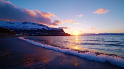 Fototapeta premium Serene Winter Sunset over Snowy Mountains and Ocean Beach