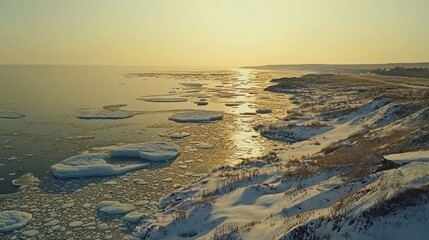 Aerial sunset view icy coast, winter landscape, frozen sea